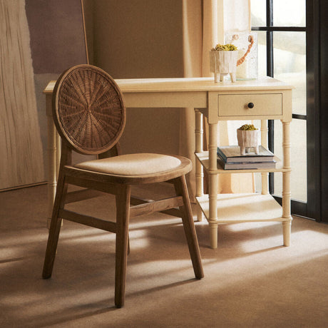 Orsina Dining Chair with a woven backrest and light wood frame, perfect for stylish interiors