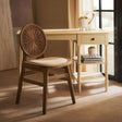 Orsina Dining Chair with a woven backrest and light wood frame, perfect for stylish interiors