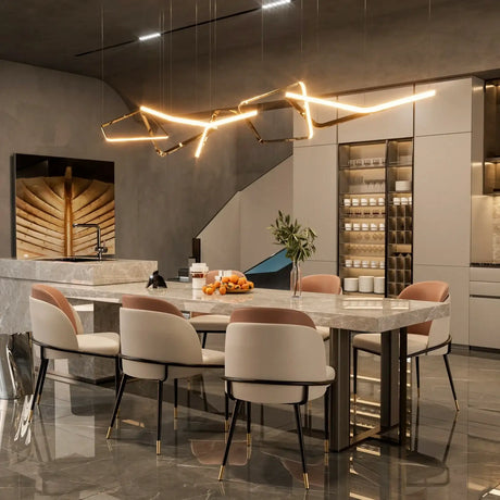 Elegant Klassyx dining chairs around a modern marble dining table in a stylish kitchen