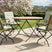 MINT Outdoor Dining Set featuring a round table and two comfortable folding chairs