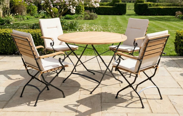 MINT Outdoor Dining Set featuring a round wooden table and four elegant folding chairs
