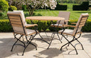 MINT Outdoor Dining Set with Wooden Table and Folding Chairs in a Garden Setting
