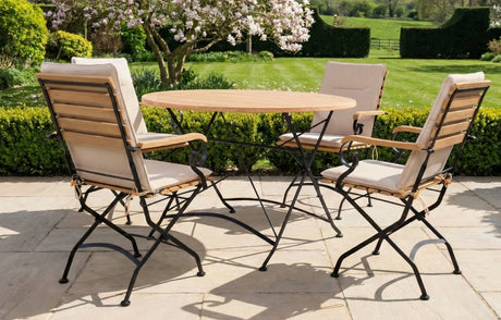 MINT Outdoor Dining Set with Wooden Table and Folding Chairs in a Garden Setting