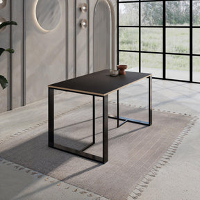 Decortie modern dining table with a sleek black finish in a stylish dining room setting