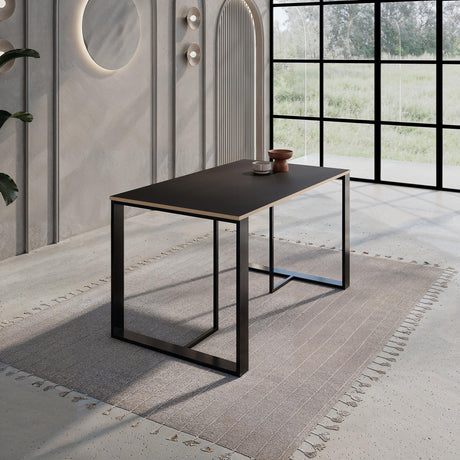 Decortie modern dining table with a sleek black finish in a stylish dining room setting
