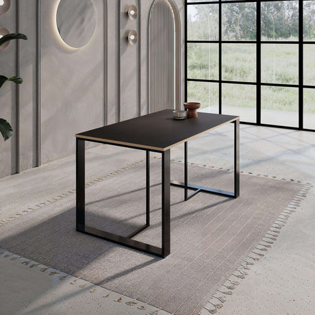 Decortie modern dining table with a sleek black finish in a stylish dining room setting