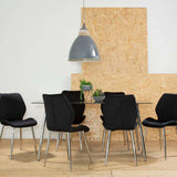 Orsina Dining Table with Stylish Black Chairs in a Modern Dining Room Setting