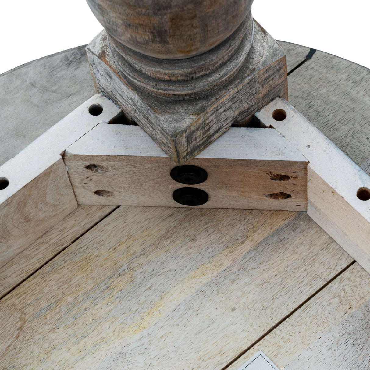 Close-up view of a sturdy wooden Dining Table featuring detailed craftsmanship and support structure