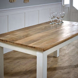 Verty Furniture Dining Table with a rustic wooden top and white painted legs, perfect for family gatherings.