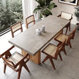 Nisu Home Dining Table with a modern concrete top and wooden base surrounded by stylish chairs