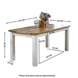 Verty Furniture Dining Table with a rustic wooden top and white legs, perfect for family meals