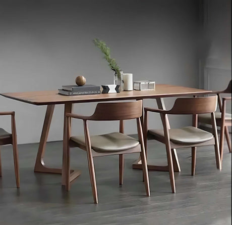 Modern Nisu Home dining table in a light wood finish with stylish chairs for contemporary dining spaces
