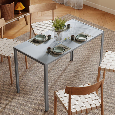 Modern grey Dining Table by Wise Galleria with simple design, styled with plates and greenery