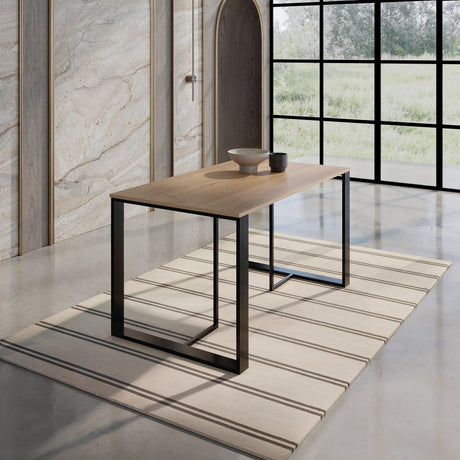 Decortie Dining Table with a wooden top and sleek black metal legs in a modern dining space