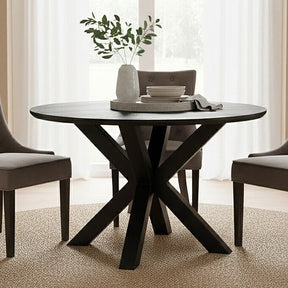 Orsina round dining table with unique cross-legged design, perfect for modern dining spaces