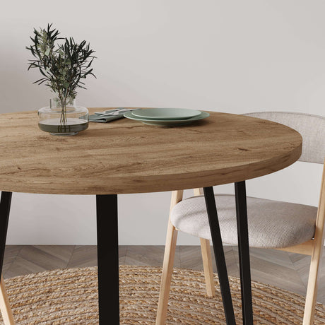 Stylish Decortie Dining Table with an Oval Wooden Top and Minimalist Black Legs