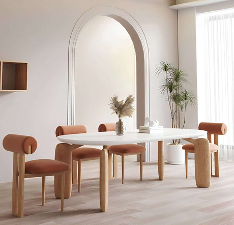 Modern Nisu Home Dining Table in white with rounded wooden legs and stylish chairs