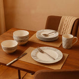 Orsina Dinner Set featuring marble-patterned plates, bowls, and mugs for elegant dining