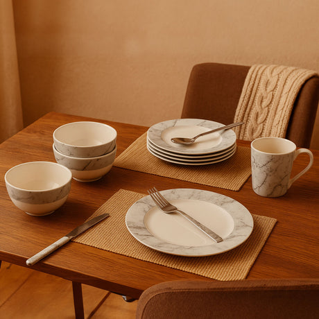 Orsina Dinner Set featuring marble-patterned plates, bowls, and mugs for elegant dining