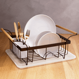 Orsina Dish Drainer with white plates and gold cutlery on a wooden countertop