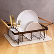 Orsina Dish Drainer with white plates and gold cutlery on a wooden countertop