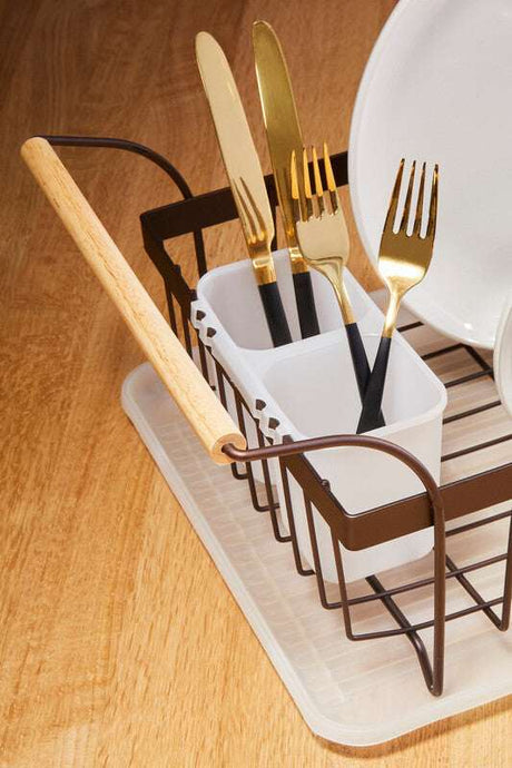 Orsina Dish Drainer with Gold-Plated Cutlery and White Storage Containers on Wooden Surface