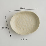 Doshim Tableware oval ceramic plate in cream colour measuring 16cm by 12.5cm with textured finish