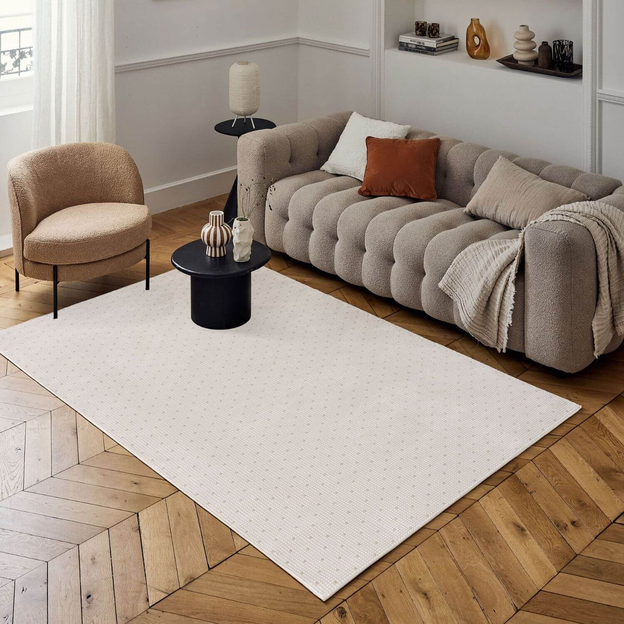 Dots Rug in a modern living room setting with a comfortable sofa and stylish decor