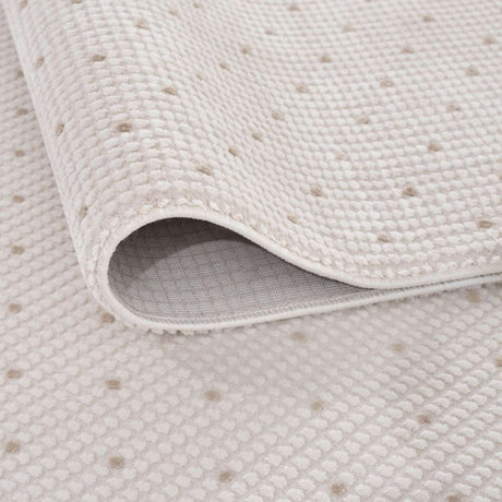 Close-up of a soft Dots Rug with a textured surface in neutral tones, ideal for any home decor