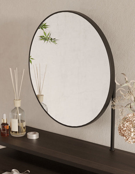 Le Di Vita modern round mirror on a sleek dressing table with elegant decor elements