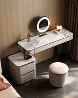 Le Di Vita modern dressing table with marble finish, round mirror, and stylish stool in a chic bedroom setting