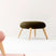 Le Di Vita Dressing Table Stool with a plush olive green seat and natural wooden legs
