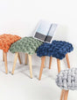 Le Di Vita dressing table stool available in multiple colours with a plush woven seat and wooden legs