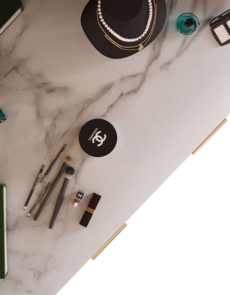 Elegant marble dressing table with makeup products and accessories for stylish organisation