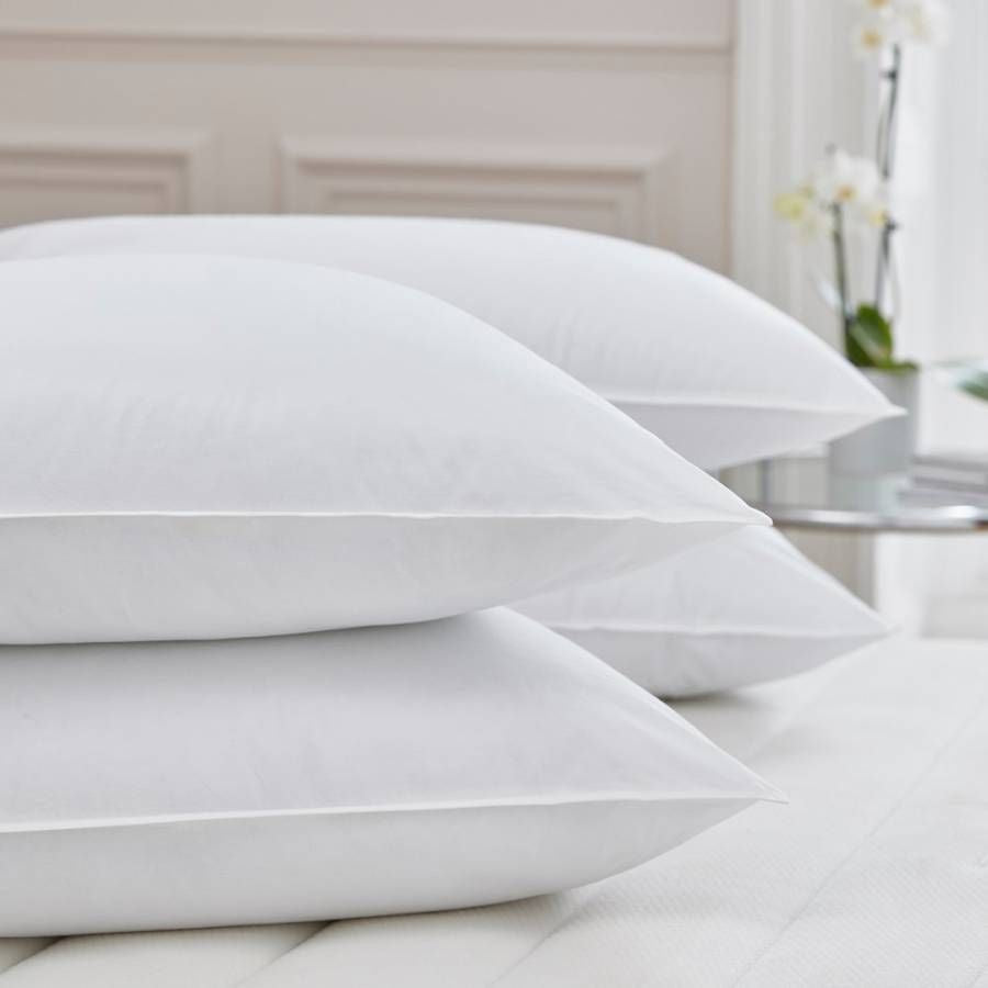 PillowPillow Duck Down Pillow set stacked on a soft, neutral-coloured bed for ultimate comfort