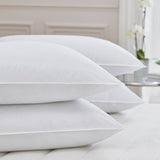 PillowPillow Duck Down Pillow set stacked on a soft, neutral-coloured bed for ultimate comfort