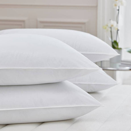 PillowPillow Duck Down Pillow set stacked on a soft, neutral-coloured bed for ultimate comfort