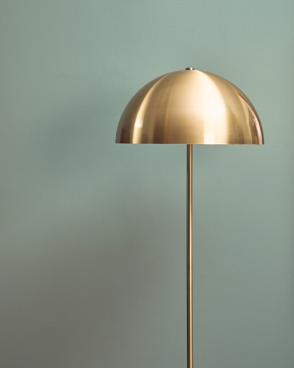 Orsina Floor Lamp with a sleek brass dome shade and elegant design for modern interiors