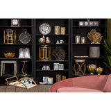 Stylish living room display featuring an Embroidered Cushion among decorative shelves and gold accents