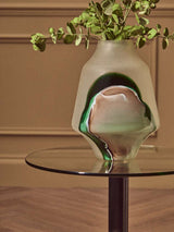 Orsina End Table with Glass Surface and Modern Design, styled with a decorative vase and greenery