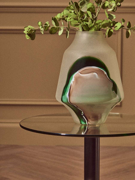 Orsina End Table with Glass Surface and Modern Design, styled with a decorative vase and greenery