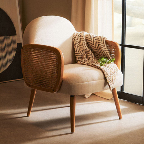 Stylish Fabric and Cane Chair from Orsina with a cosy blanket draped over it, perfect for any living space