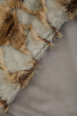 Orsina Fur Throw featuring a soft, luxurious texture in natural shades for cosy living spaces
