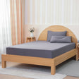 SHEET STORY Grey Fitted Sheet on a light wood bed with matching pillows for a stylish bedroom look
