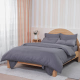 Grey Fitted Sheet by SHEET STORY on a wooden bed in a stylish bedroom setting