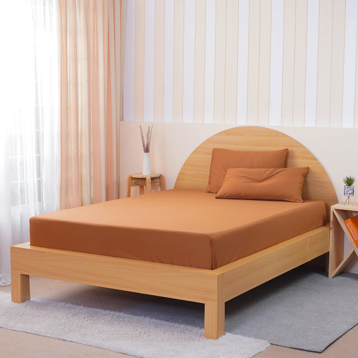 SHEET STORY Fitted Sheet in warm terracotta on a minimalist wooden bed frame