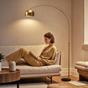 Stylish Wise Galleria Floor Lamp in a living room, providing warm light for reading on a sofa