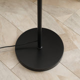 Stylish black base of the Wise Galleria Floor Lamp on a wooden floor, featuring a minimalist design