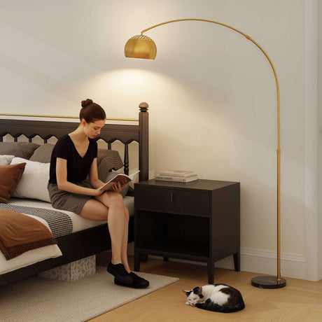 Elegant Wise Galleria Floor Lamp with a gold shade illuminating a cozy reading nook next to a bed