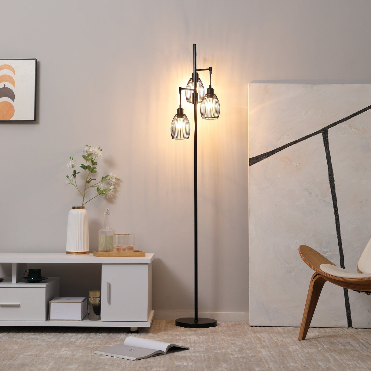 Wise Galleria Floor Lamp with three glass shades providing warm ambient light for living spaces